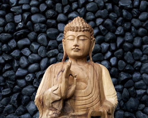 A serene scene with stacked stones, symbolizing balance and philosophy.